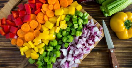 cutting-board-filled-with-a-rainbow-of-chopped-vegetables
