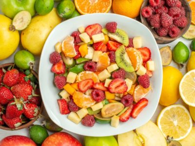 top view tasty fruit salad with different fruits on a white background mellow berry photo tree ripe fruity