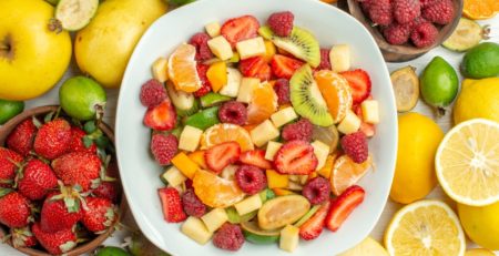 top view tasty fruit salad with different fruits on a white background mellow berry photo tree ripe fruity